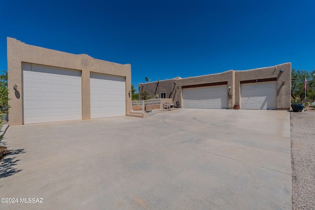 garage with concrete driveway