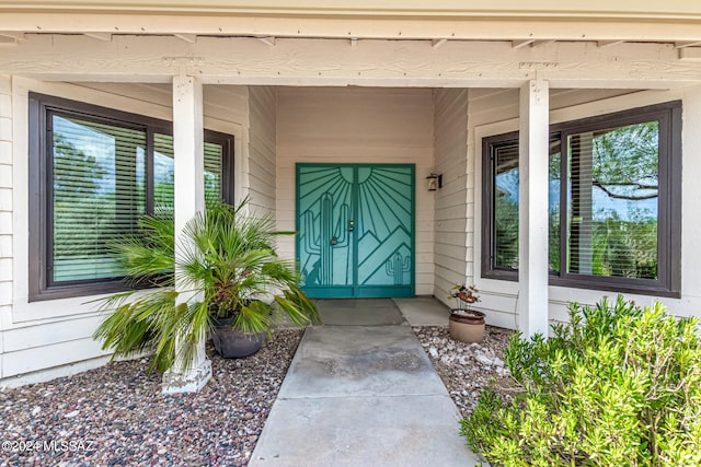 doorway to property featuring a porch