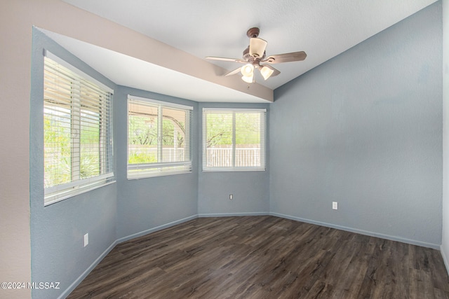 unfurnished room with dark hardwood / wood-style flooring and ceiling fan