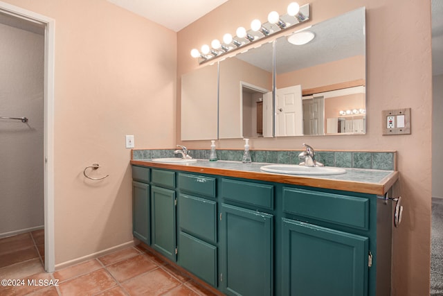 bathroom with vanity and tile patterned floors