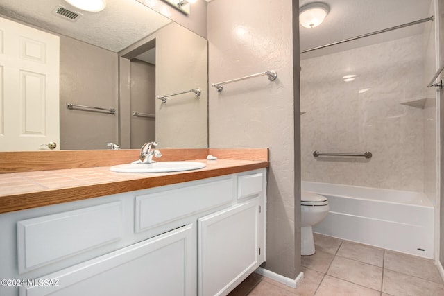 full bathroom featuring vanity, toilet, a textured ceiling, washtub / shower combination, and tile patterned flooring