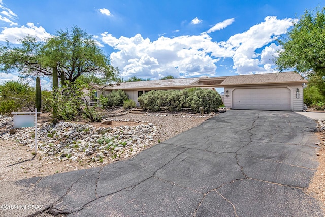 view of front facade with driveway and an attached garage