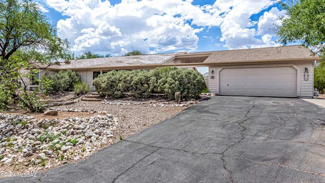 ranch-style home with a garage