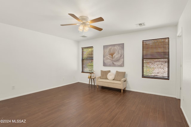 unfurnished room with dark hardwood / wood-style floors and ceiling fan