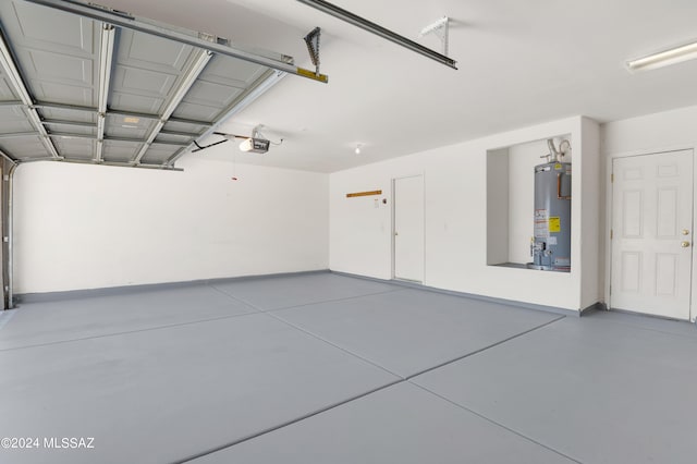 garage featuring a garage door opener and gas water heater