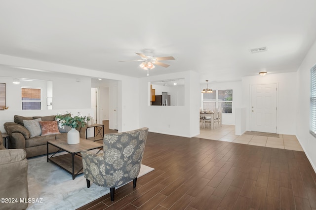 living room with ceiling fan and hardwood / wood-style floors