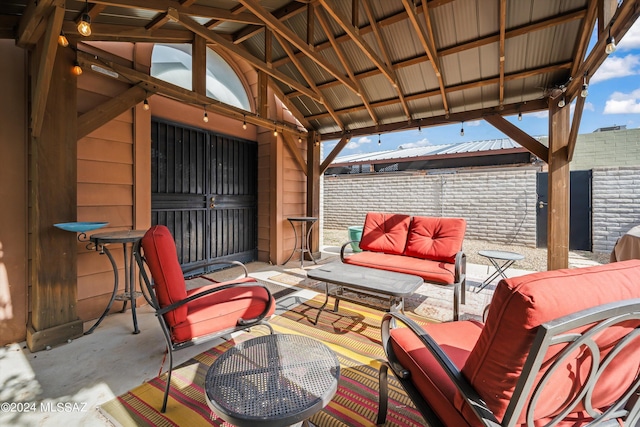 view of patio featuring a gazebo and outdoor lounge area