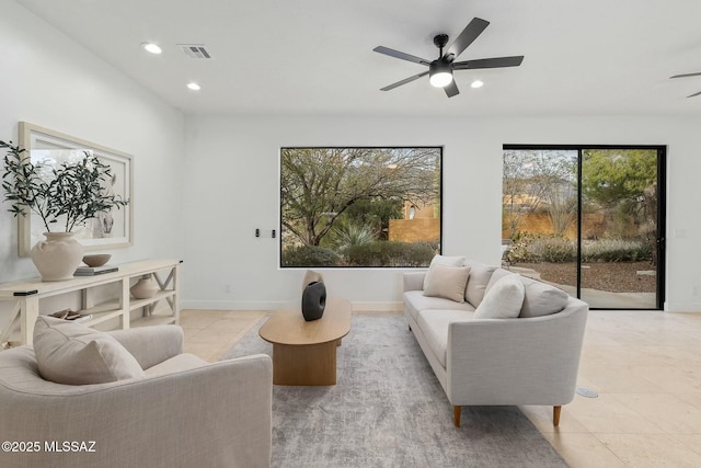 tiled living room featuring ceiling fan