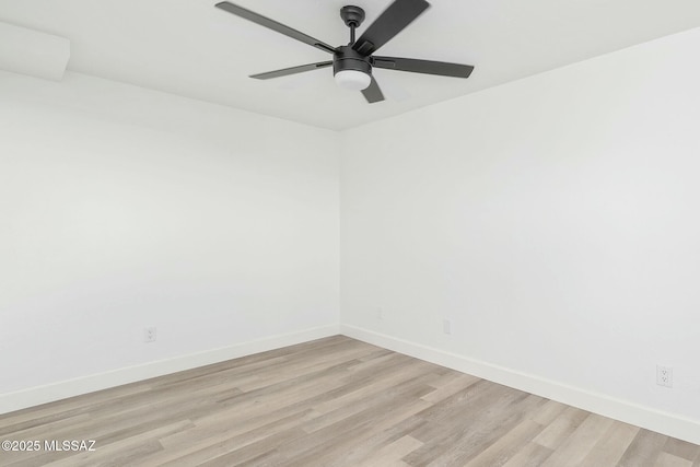 empty room featuring light hardwood / wood-style floors and ceiling fan