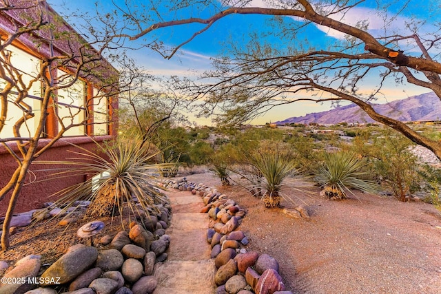 yard at dusk with a mountain view