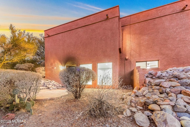 view of property exterior at dusk