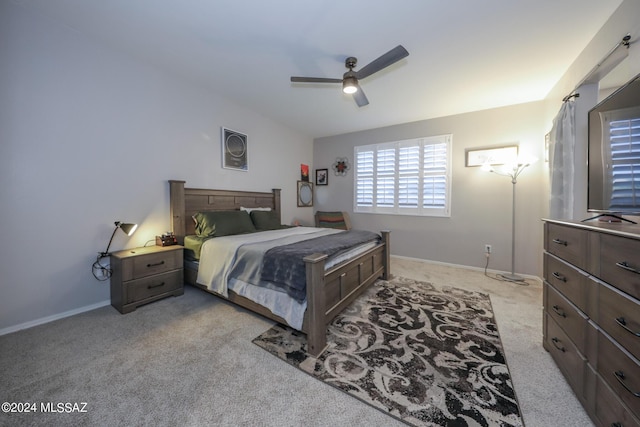 bedroom with light colored carpet and ceiling fan