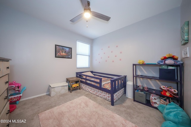 bedroom with light carpet and ceiling fan