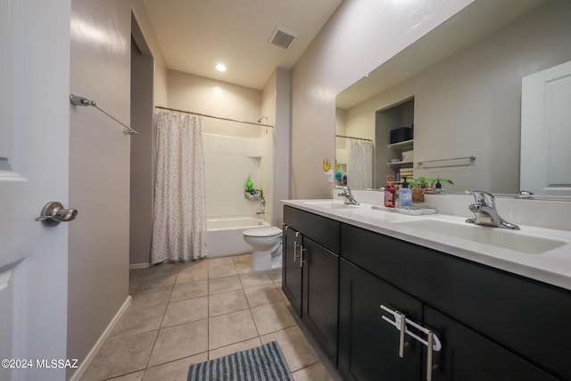 full bathroom with vanity, shower / bath combo with shower curtain, tile patterned flooring, and toilet