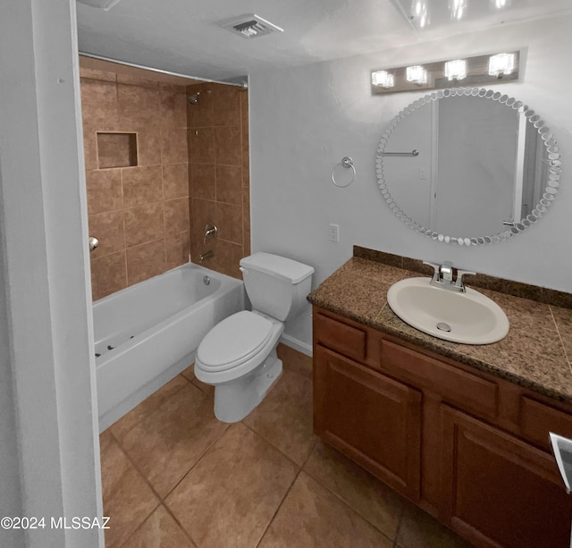 full bathroom with tile patterned flooring, vanity, toilet, and tiled shower / bath