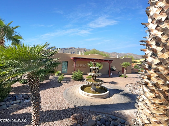 rear view of house with a mountain view