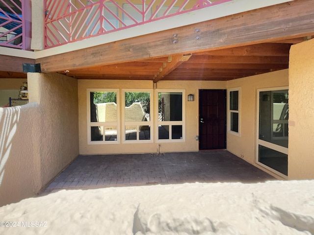 property entrance with a patio