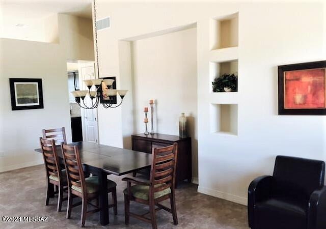 dining space featuring a notable chandelier