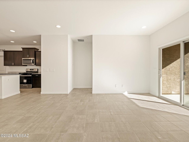 unfurnished living room featuring light tile patterned flooring