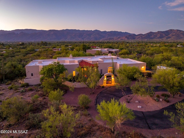 aerial view at dusk with a mountain view