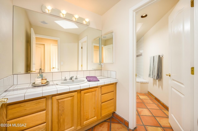 bathroom with vanity and tile patterned flooring