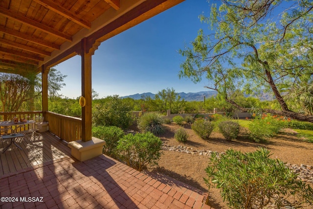 view of patio featuring a deck with mountain view