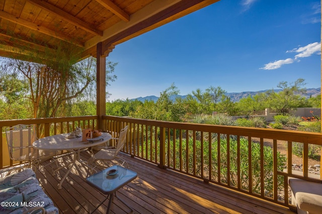 wooden terrace with a mountain view