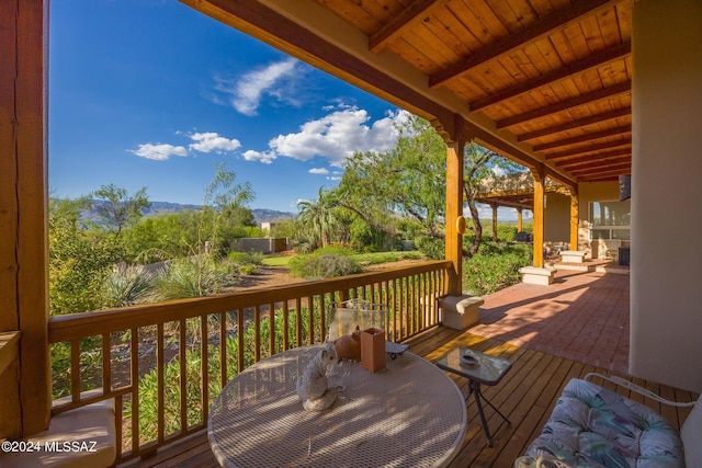 wooden deck featuring area for grilling