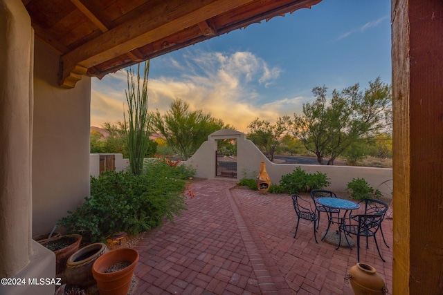 view of patio terrace at dusk