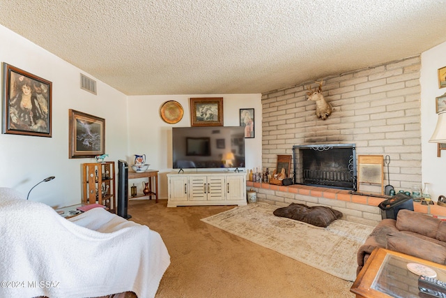 carpeted living room with a fireplace and a textured ceiling