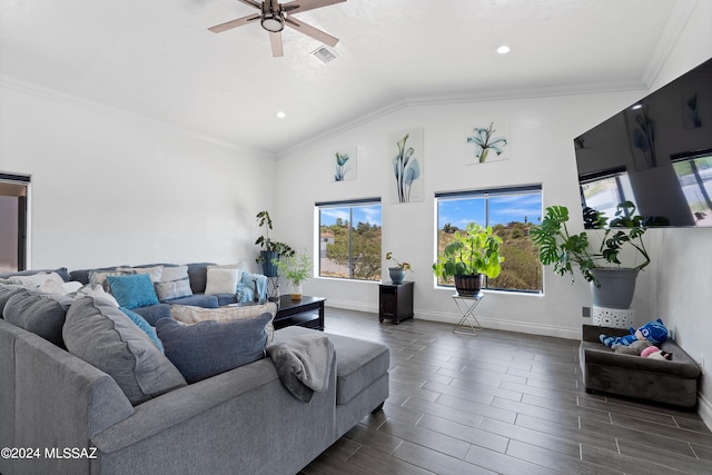 living room with ornamental molding, ceiling fan, vaulted ceiling, and dark wood-type flooring