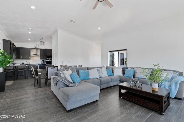 living room featuring crown molding and ceiling fan