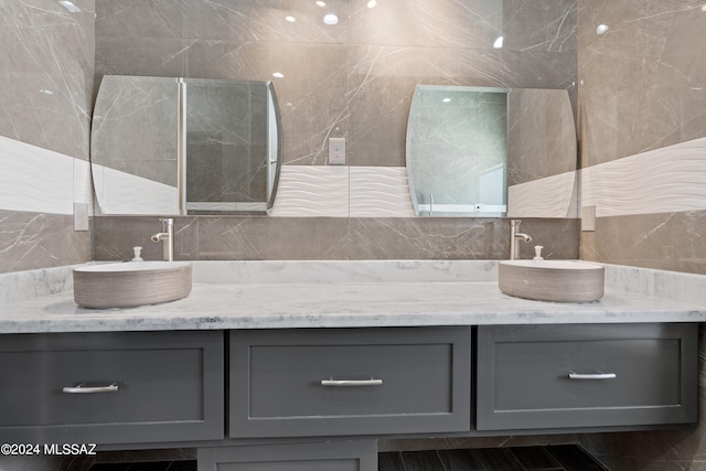 bathroom with vanity, tile walls, and tile patterned floors