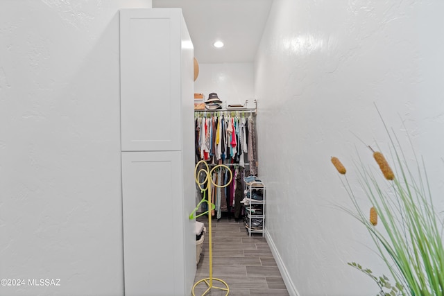 spacious closet featuring hardwood / wood-style floors