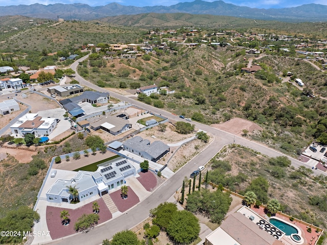 birds eye view of property featuring a mountain view