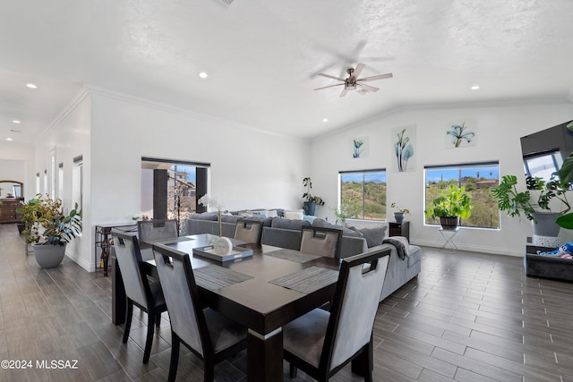 dining room with ornamental molding, lofted ceiling, ceiling fan, and dark hardwood / wood-style floors