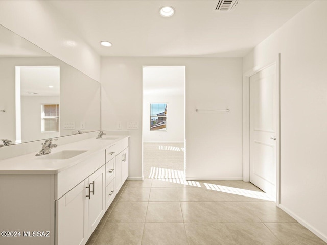 bathroom with tile patterned flooring and vanity