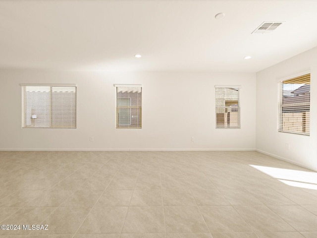 spare room with light tile patterned floors