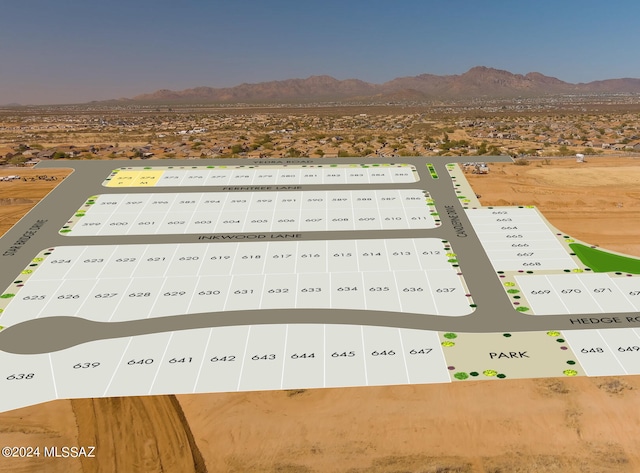 birds eye view of property with a mountain view