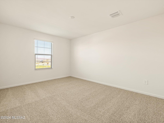 spare room featuring carpet floors