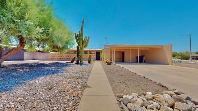 view of front of home featuring a carport