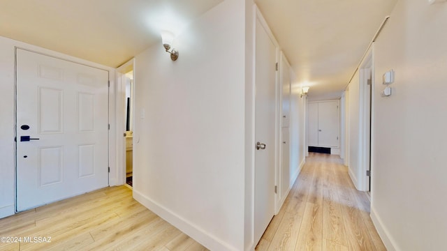 hallway with light wood-type flooring