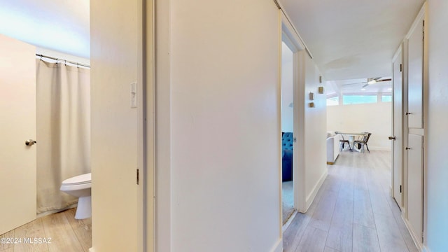 hallway with light wood-type flooring