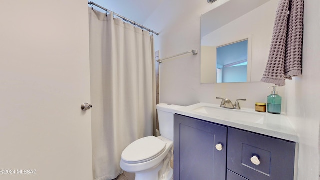 bathroom with a shower with shower curtain, vanity, and toilet