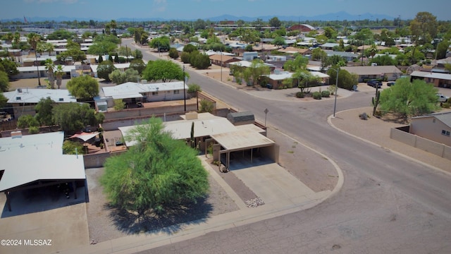 birds eye view of property featuring a mountain view