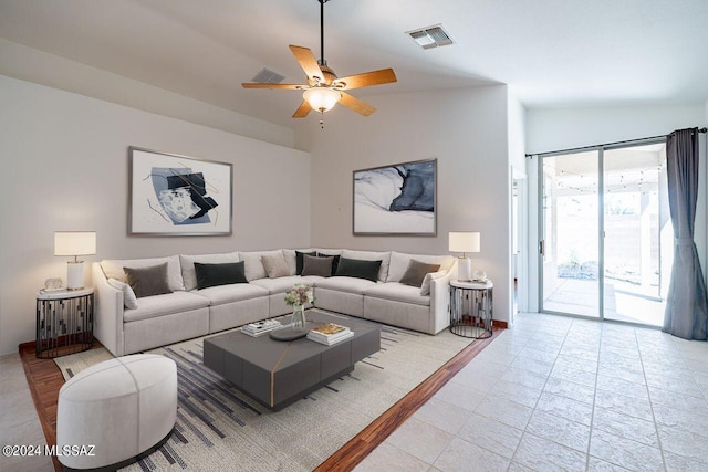 living room featuring lofted ceiling and ceiling fan