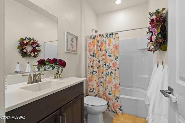 full bathroom featuring toilet, vanity, and shower / tub combo with curtain