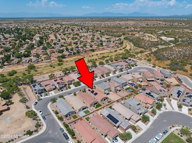 birds eye view of property featuring a mountain view