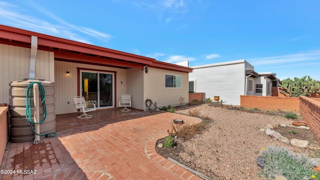 rear view of house with a patio