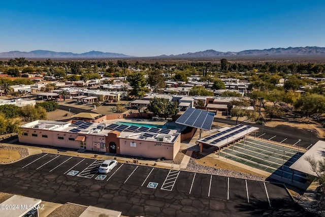 birds eye view of property with a mountain view